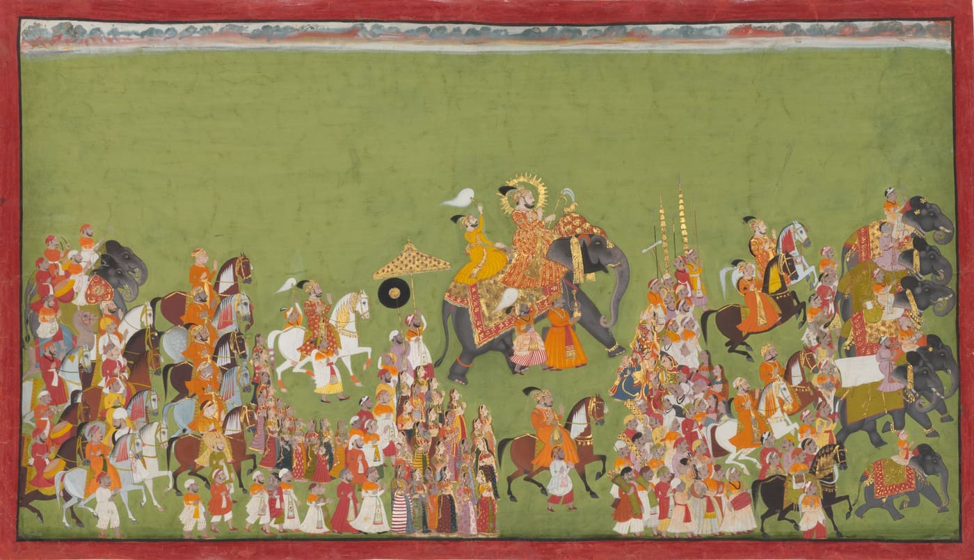 A royal wedding procession of horses, elephants and drummers